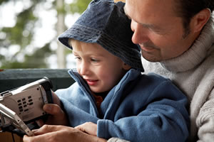 man and child looking at camera